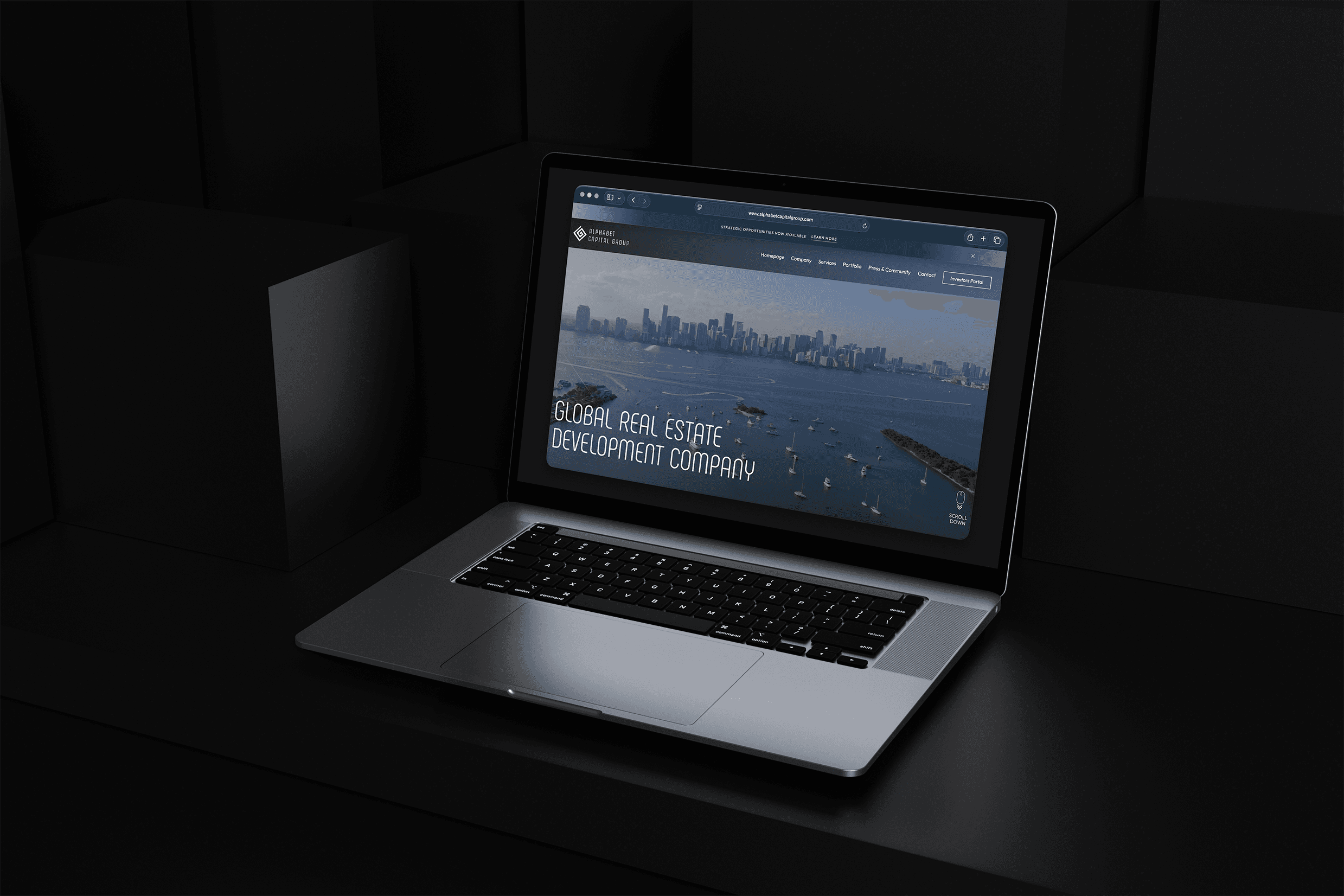 Alphabet Capital Group website displayed on a laptop above a black marble pedestal.
